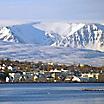 View of Akureyri, Iceland with ice covered mountains in the background