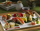 Plate of fresh assorted sushi and sashimi rolls.
