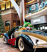 Presents and Christmas Decorations around Vintage Car